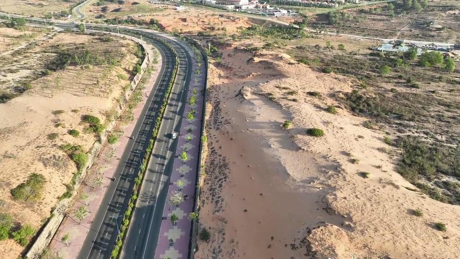 An empty desert interstate running straight to the horizon